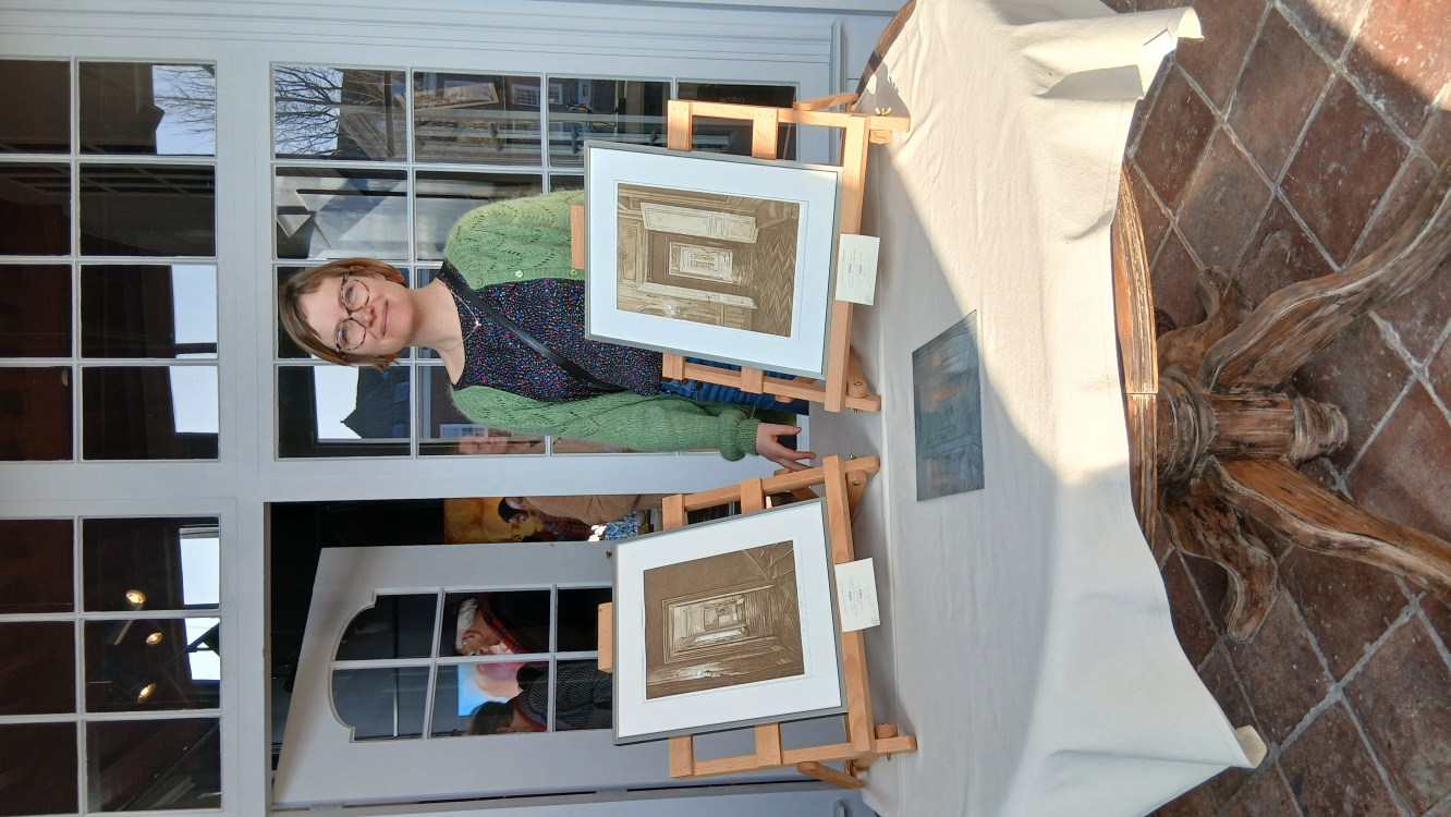 Roos with some of her prints