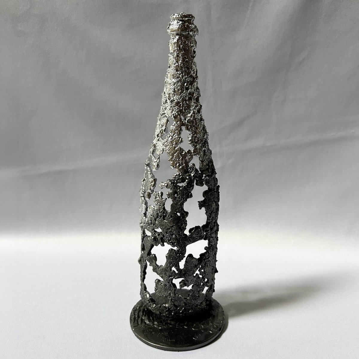 Wine Bottle 38-25 – Contemporary Steel Lace Bottle Sculpture with Chrome Finish