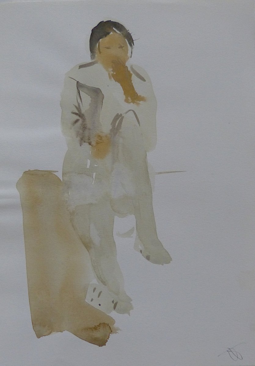 The woman sitting on the floor